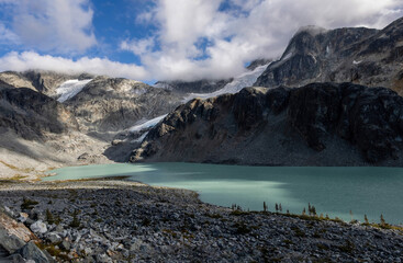Beautiful view from Wedgemont Lake hike in British Columbia, Canada. View of mountains, glaciers, cloudy sky and Wedgemont lake.