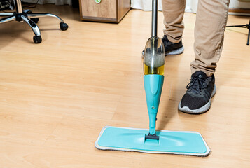 Cleaning the floors of an office with the mop. Cleaning work.