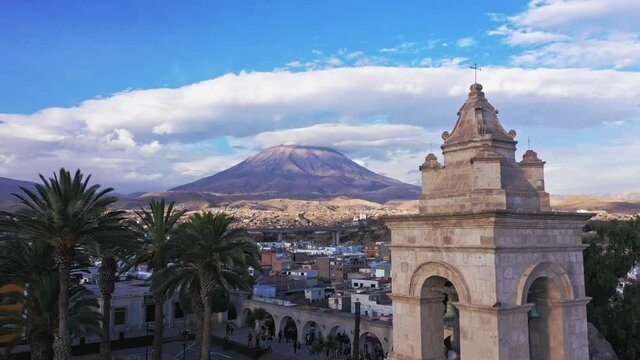 Arequipa bell tower cathdral and volcano drone