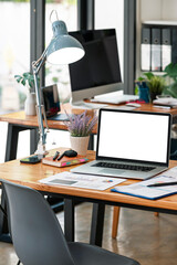 Mockup white screen portable tablet with magic keyboard on wooden table in co-workspace.