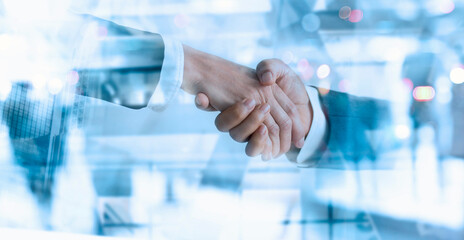 Businessman partners handshake for successful of investment deal and finishing up a meeting. Financial, marketing and teamwork .
