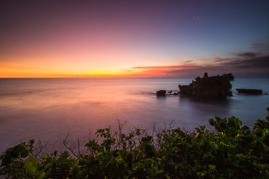 sunset over the ocean © Gede