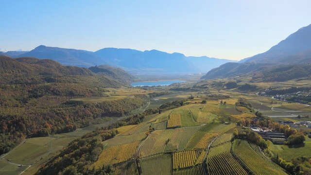aerial drone shot of the beautiful Lago di Caldaro Sea in South Tyrol Italy in Autumn, Fall.