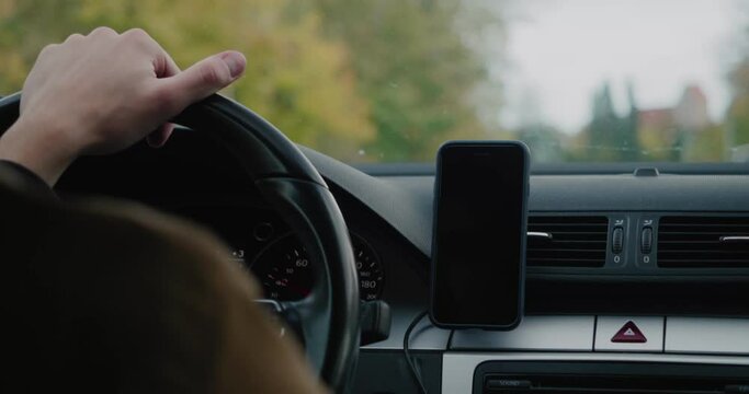 Phone Attached To Dashboard While Driving on a Bumpy Road With Yellow Trees Around in Autumn, Simrishamn Sweden - Handheld Medium Shot