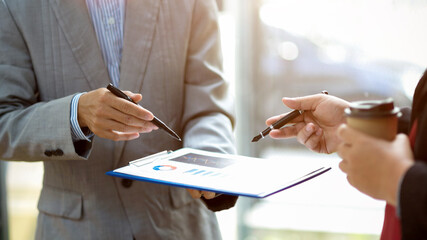 Male financial analysts talking the financial work with a female manager