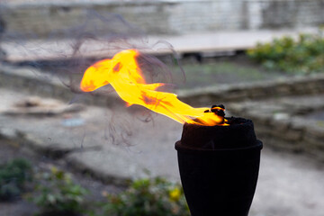 A burning torch with yellow flame