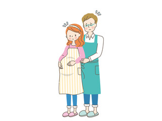 お腹の中の赤ちゃんを心配する妊婦と寄り添う夫