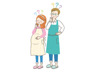 疑問を持つ若い妊婦さんとエプロン姿の夫