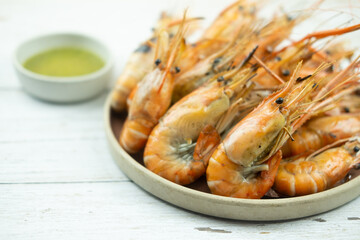 Grilled shrimp eating with seafood dipping sauce