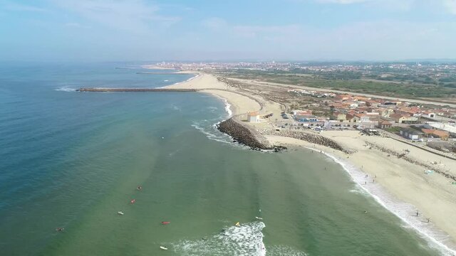 In the north of Portugal, some chapels are located right on the beach! Surfing with friends on a warm summer day.