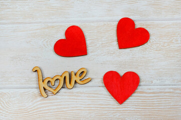 valentines day greeting card close up, festive wooden decorations shape love and hearts