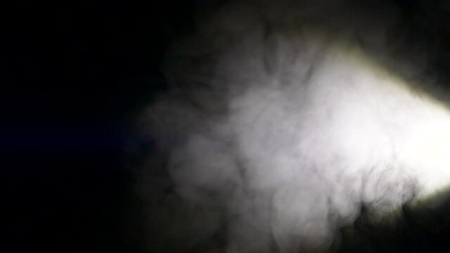 Slow motion of white abstract smoke, fog, steam cloud, mist on black background