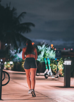 woman walking on the street at night running sport Brickell miami 