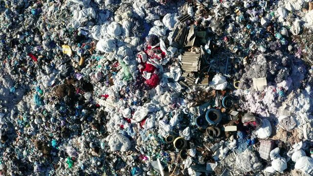 Aerial view of a city dump. The concept of pollution and excessive consumption.