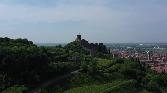 Italian historic castles. Aerial panorama of the castles of Italy. The famous medieval castle on the hill. Aerial view of Soave castle, Verona province, Italy.