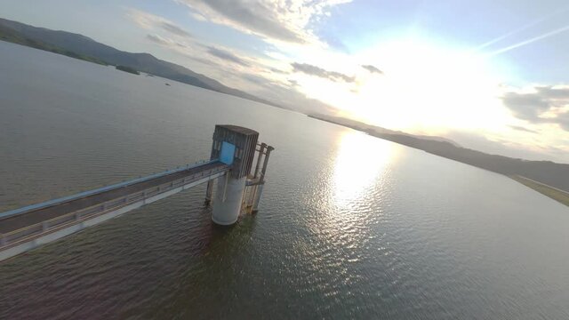 Acrobatic drone passing through structure of Hatillo dam pump station, Dominican Republic. Aerial fpv