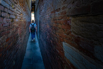 person walking in the tunnel