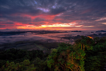 Fototapeta premium Background of mountains and nature surrounded, bright blue sky wallpaper. There are trees, green leaves, a beautiful ecology.