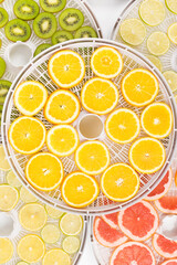 drying trays with fresh fruit wedges, background