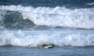 Surfer practicing his skills in the Atlantic ocean at Lanzarote