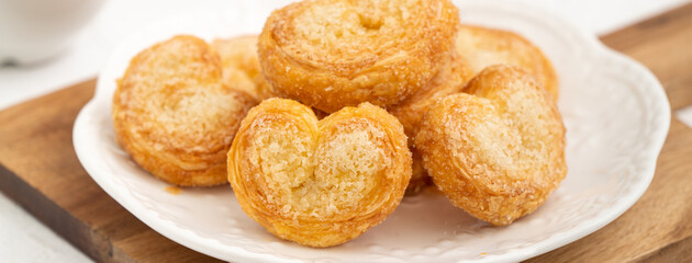 Delicious Palmier butterfly pastry in heart shape for Valentine's day dessert.