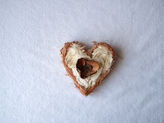 heart from dried flowers on a white background