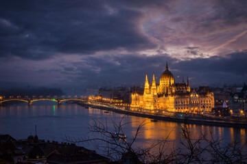 The illuminated skyline of Budapest with Parliament building and Margaret Bridge during dusk, Hungary