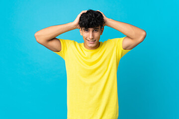 Young Argentinian man isolated on background doing nervous gesture