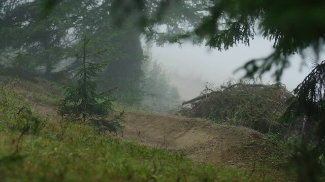 A mountain biker hits a corner very fast