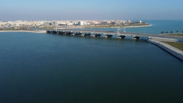 Bridge leading to Tarout island in Qatif, aerial drone fly over shot