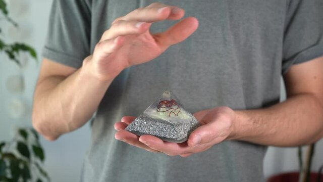 Close-up of man working with orgonite stone energies