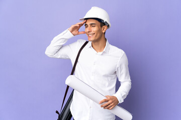 Young architect man isolated on background smiling a lot
