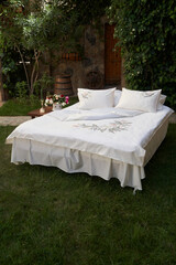 Bedroom bed with pillows and bed sheets