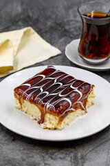 Caramel trilece dessert on dark background. Traditional Turkish cuisine flavor. close up