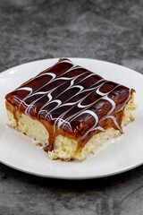 Caramel trilece dessert on dark background. Traditional Turkish cuisine flavor. close up