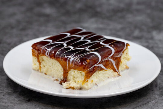 Caramel trilece dessert on dark background. Traditional Turkish cuisine flavor. close up