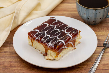 Trilece on the wooden bakground. Dessert Muhallebi Pudding with Jelly Raspberry. Close up