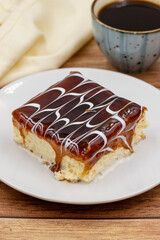 Trilece on the wooden bakground. Dessert Muhallebi Pudding with Jelly Raspberry. Close up