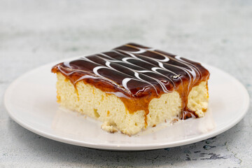 Caramel trilece dessert on stone background. Traditional Turkish cuisine flavor. close up