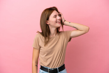 Fototapeta premium Young English woman isolated on pink background smiling a lot