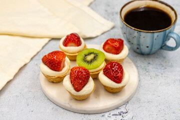 Delicious tiny tartlets on a stone background. close up