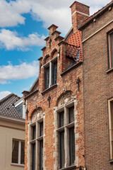 Facades and roofs of houses in the Gothic style. Bruges, Belgium