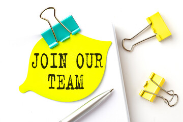 Sticker with JOIN OUR TEAM text on notebooks on the white background