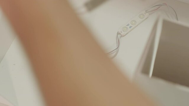 Production of advertising signs with backlit LED strip