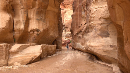 Tourist route through the gorge to Petra - Nabataean rock temple. Jordan
