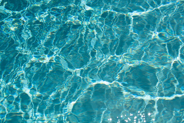 Water in swimming pool, background with high resolution. Wave abstract or rippled water texture.