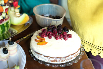 Preparing a fruit cake for a birthday - selective focus
