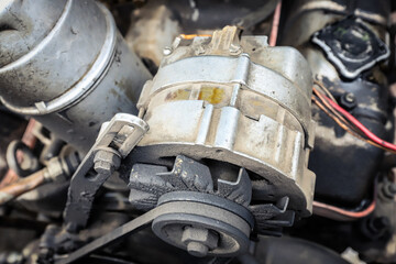 Old car generator close-up. Engine parts