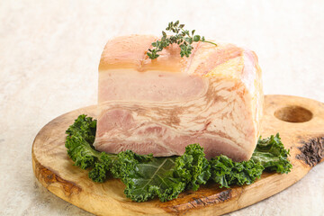 Cut of pork bacon over board