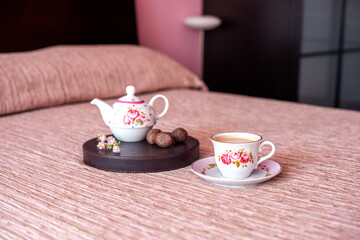 cup of tea and teapot on table